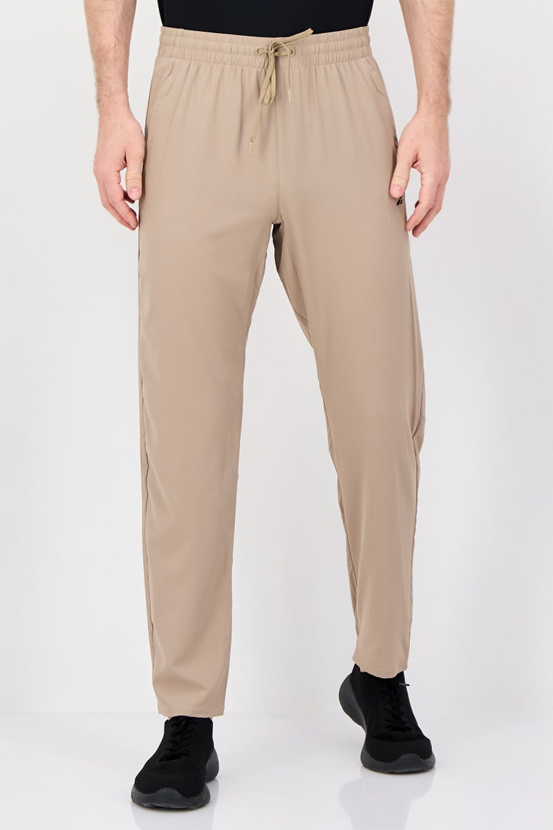 Reebok Men Sportswear Fit Brand Logo Training Track Pants, Tan - Image 1